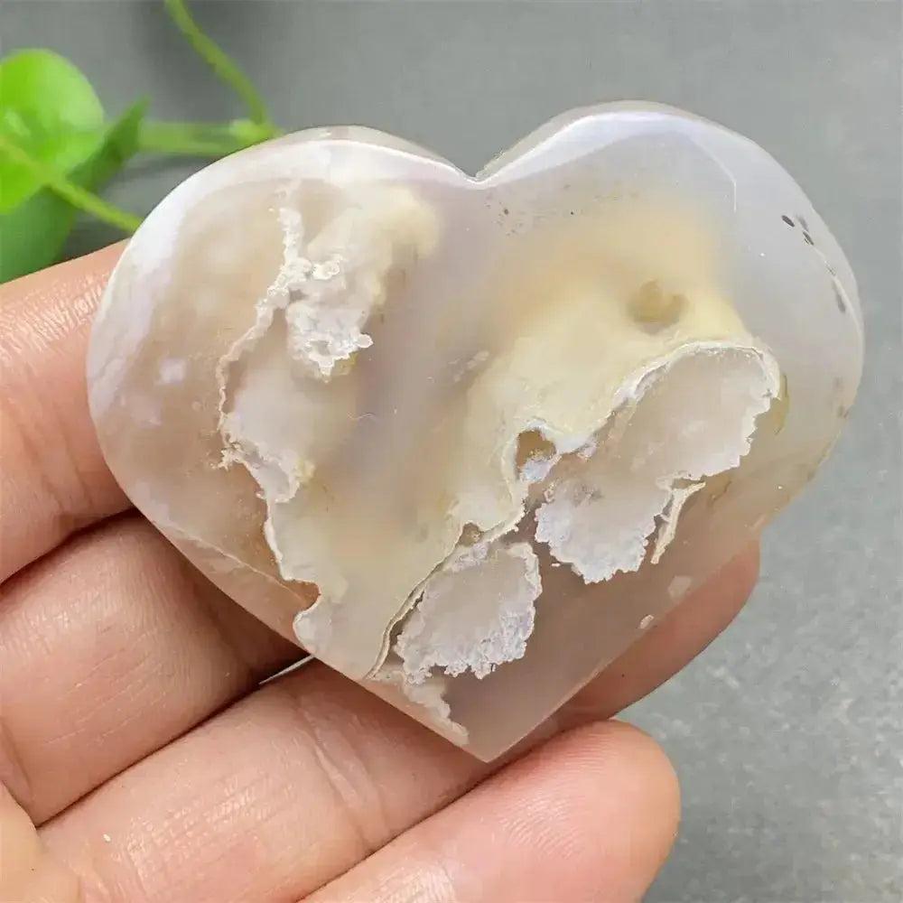 Cherry Blossom Agate Heart: Hand-polished, delicate pink and white heart-shaped crystal for emotional healing and self-love.