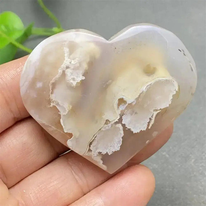 Cherry Blossom Agate Heart: Hand-polished, delicate pink and white heart-shaped crystal for emotional healing and self-love.