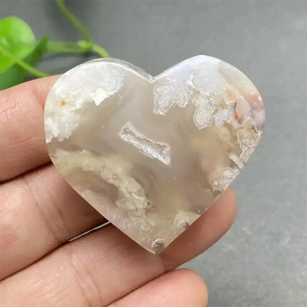 Cherry Blossom Agate Heart: Polished pink and white agate heart with unique floral inclusions, promoting self-love.