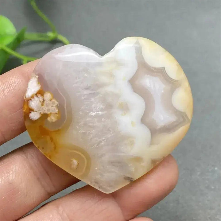 Cherry Blossom Agate Heart: Hand-polished pink and white agate heart with unique floral inclusions, promoting self-love.