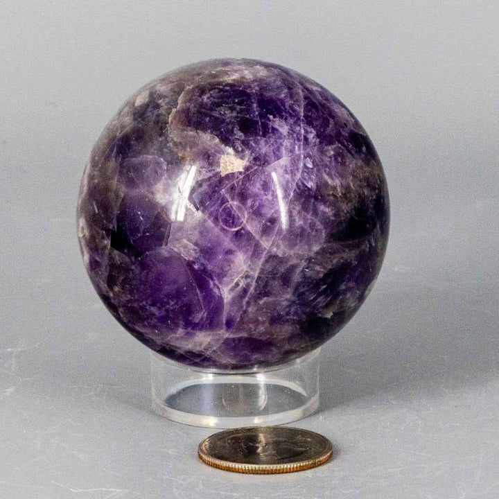 Chevron Amethyst Sphere, 58-71MM, showcasing deep violet Amethyst and white Quartz V-shaped banding.