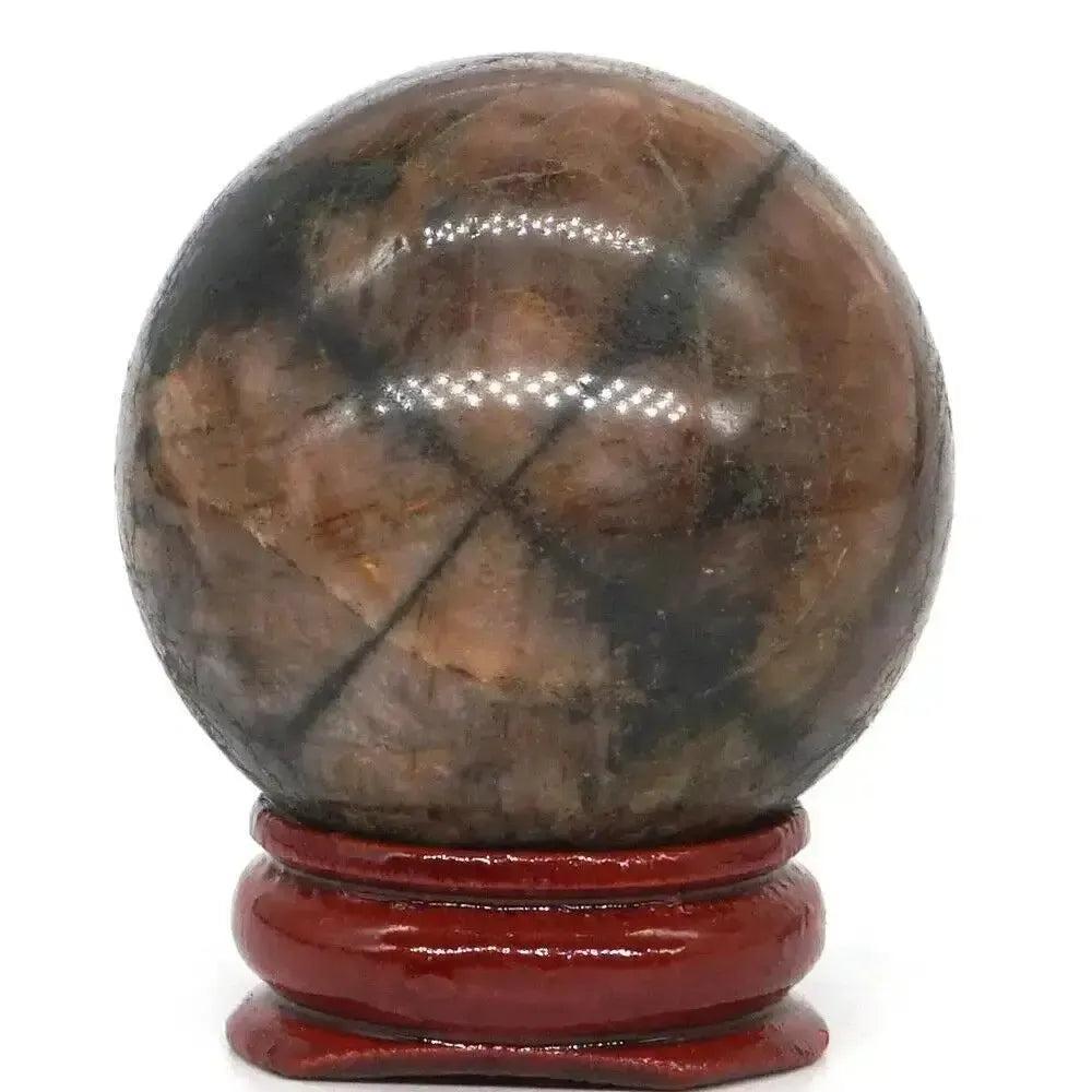 Rare Chiastolite Sphere with Stand, showcasing its distinctive dark cross pattern for protection and spiritual grounding.
