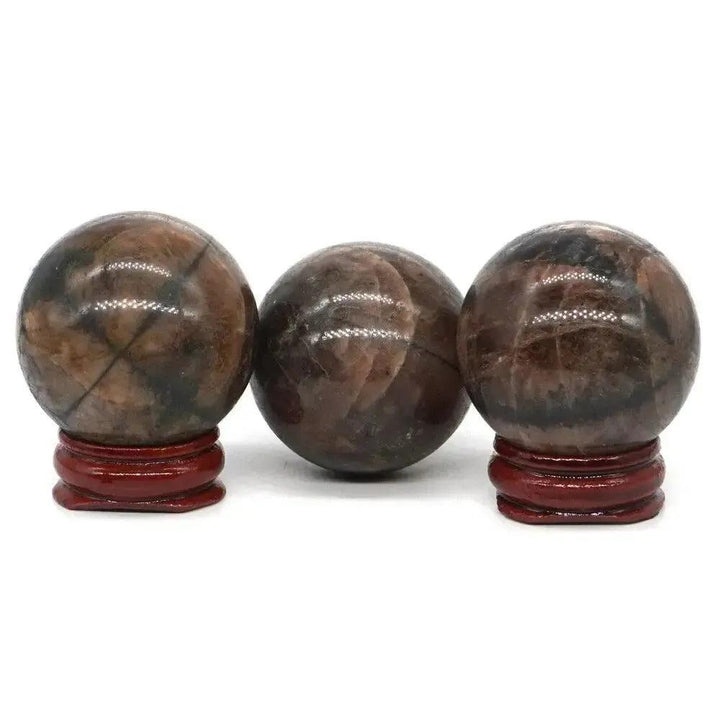 Rare Chiastolite Sphere with Stand: Polished brown sphere showcasing a distinctive dark cross pattern for protection and grounding.
