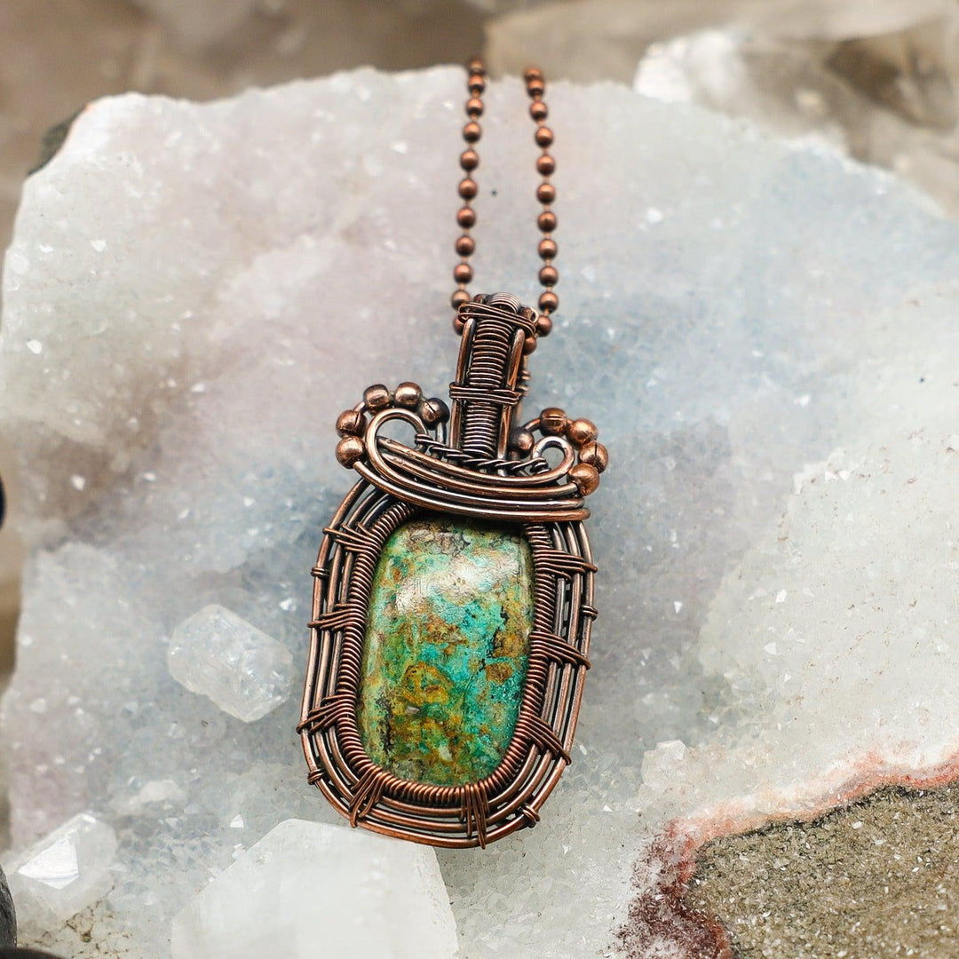 Chrysocolla Square Wire Wrap Pendant: Vibrant turquoise-blue-green crystal in handcrafted copper wire for calm and expression.