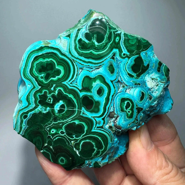 Polished Chrysocolla Malachite slab featuring vibrant blue and green swirls for heart and throat chakra transformation.