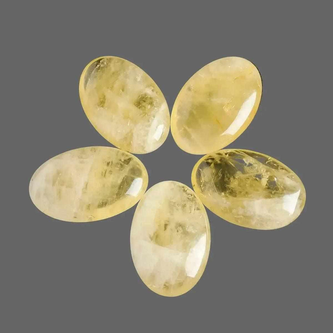 Polished natural citrine palm stone for Reiki healing, featuring a smooth, golden yellow quartz design for energy balancing.