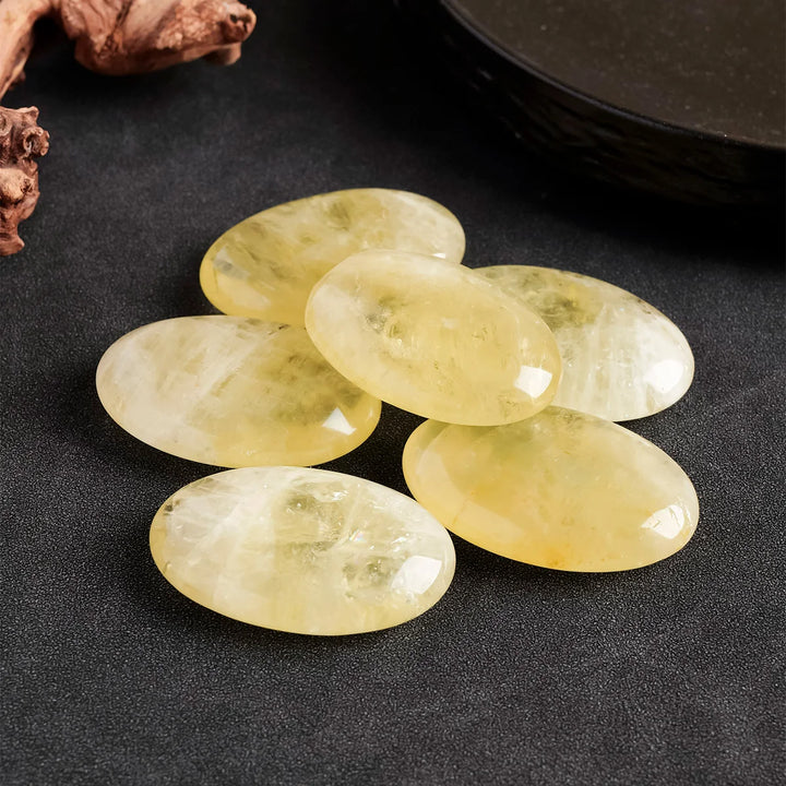 Polished natural citrine palm stones, smooth yellow quartz crystals for Reiki healing, energy balancing, and home decor.