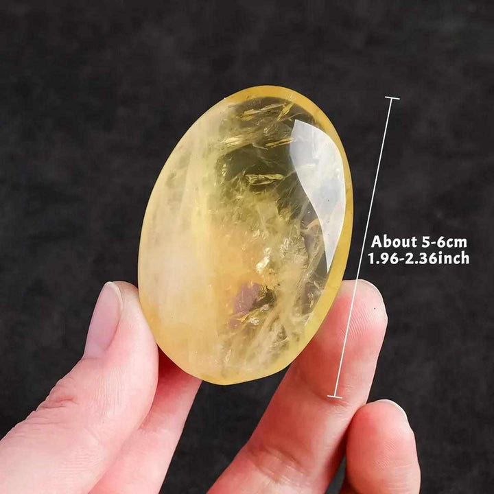 Polished natural citrine palm stone, a 5-6cm yellow quartz crystal for Reiki healing, energy balancing, and home decor.