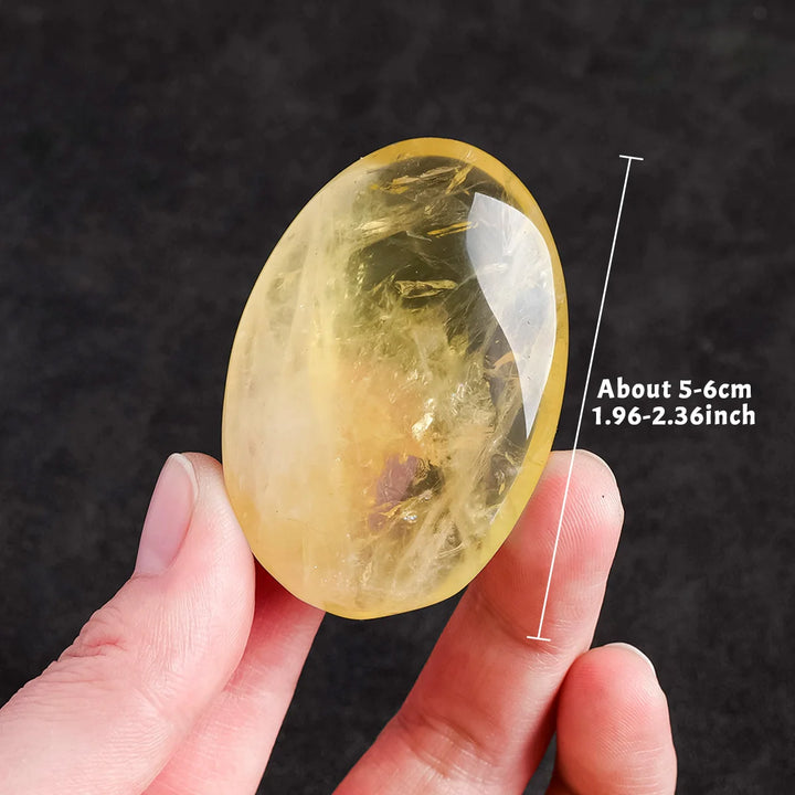 Polished natural citrine palm stone, a 5-6cm yellow quartz crystal for Reiki healing, energy balancing, and home decor.