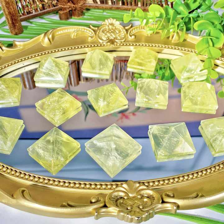 Natural Citrine crystal pyramids with vibrant yellow hues, perfect for healing energy and elegant home decor.