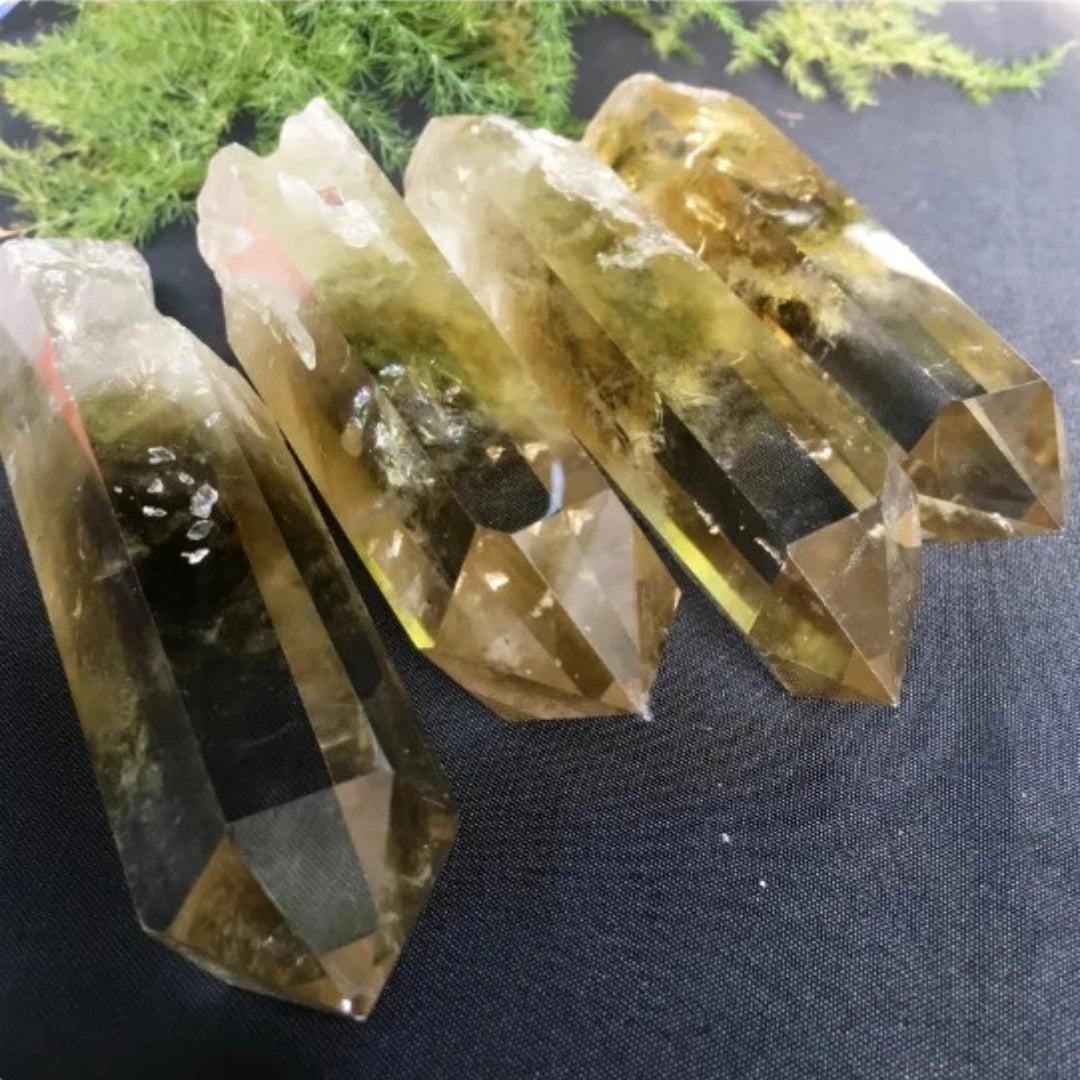 Four raw Citrine Quartz crystal points with golden hues and natural terminations for manifestation and solar plexus energy.