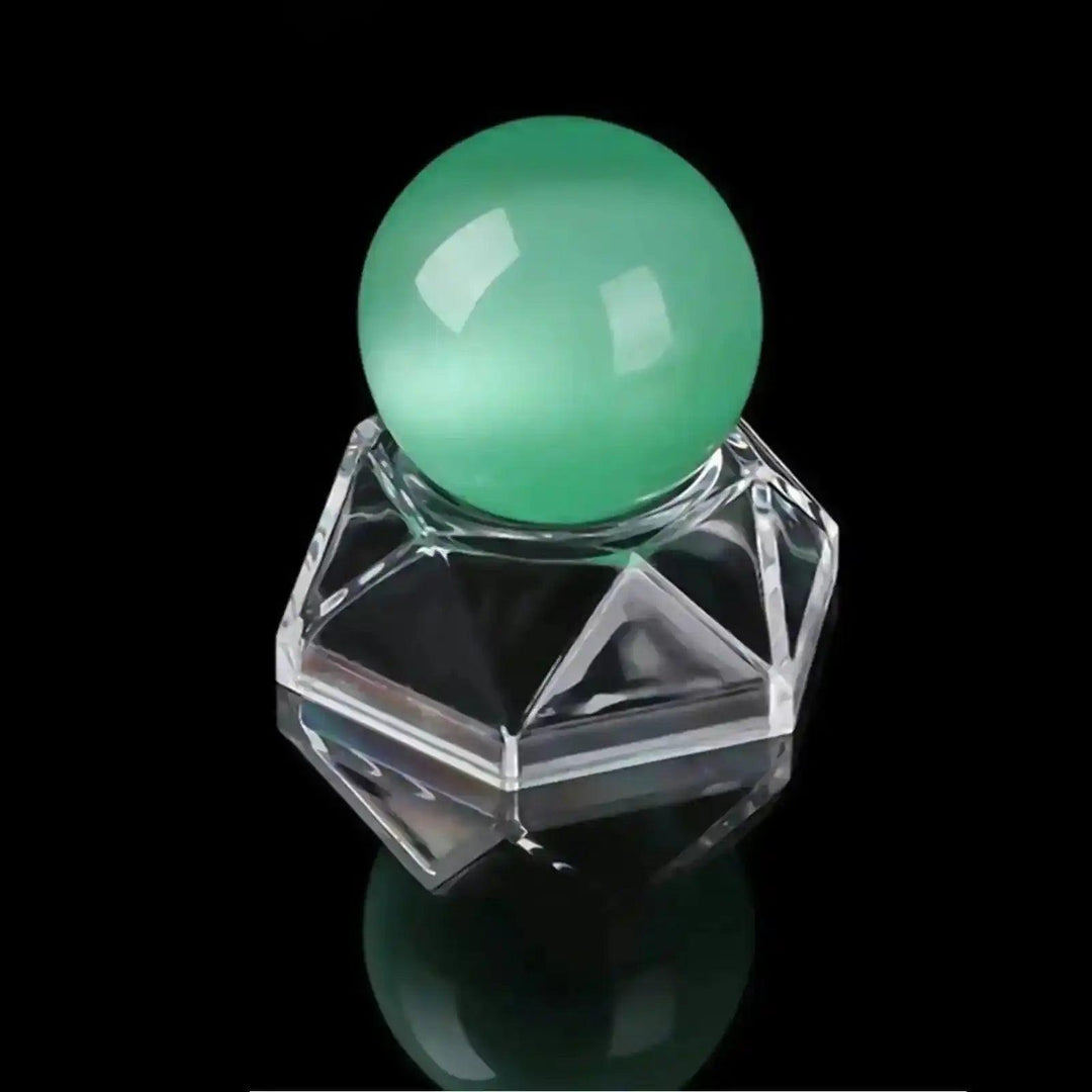 Clear hexagon Acrylic Crystal Sphere Display Stand showcasing a vibrant green crystal sphere.