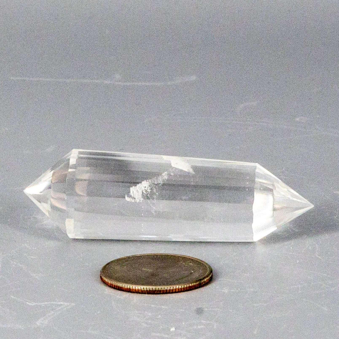 Clear Quartz 24-Faceted Vogel wand, a precision instrument with double termination and a visible white streak.