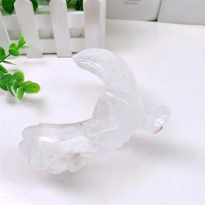 Hand-carved clear quartz eagle and pyramid statue designed to balance and spin for energy amplification and manifestation.