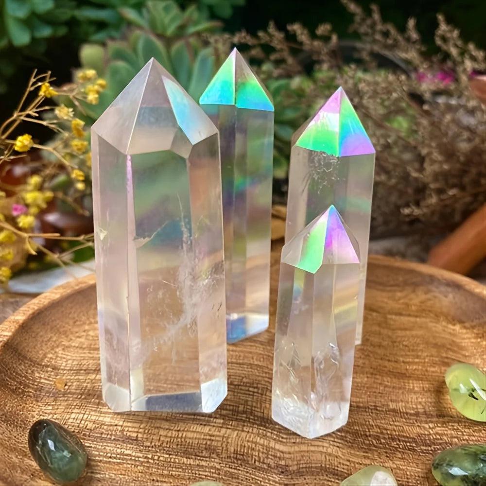 Iridescent clear quartz crystal stone towers with healing aura glow on a wooden tray.