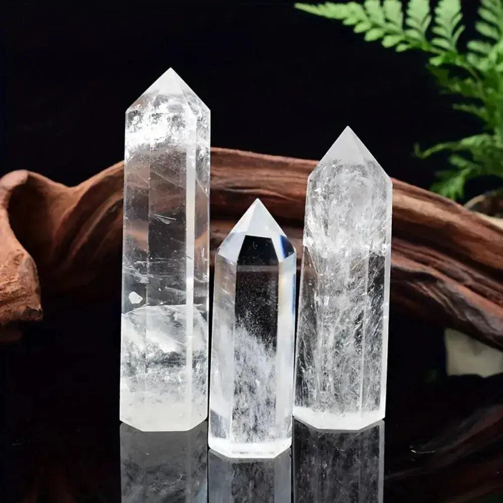 Three polished Clear Quartz Hexagonal Crystal Towers, showcasing luminous white clarity and amplifying energy.