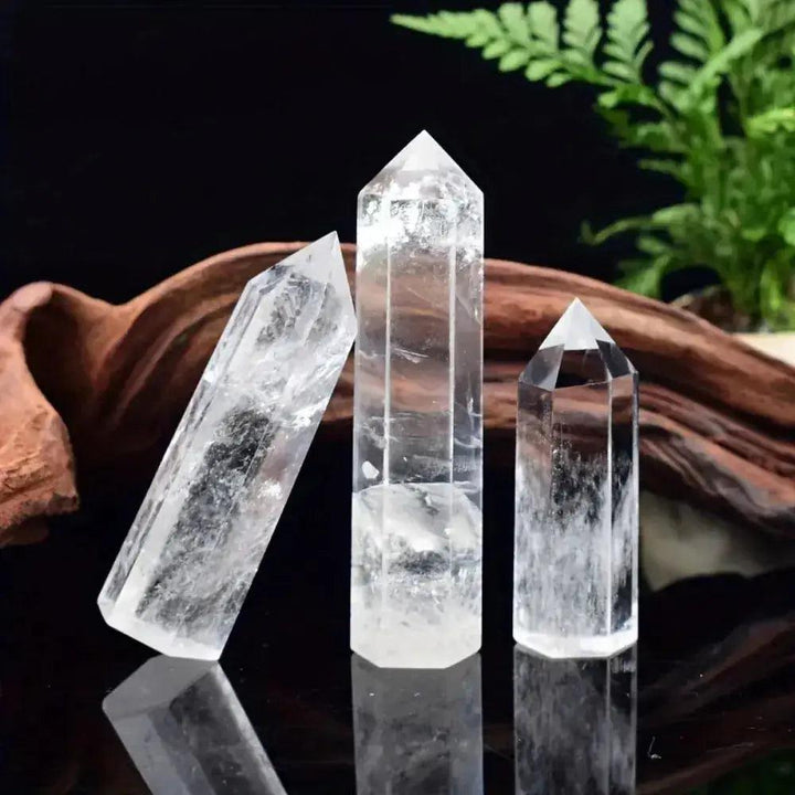 Three polished Clear Quartz Hexagonal Crystal Towers, showcasing luminous white clarity and amplifying energy.