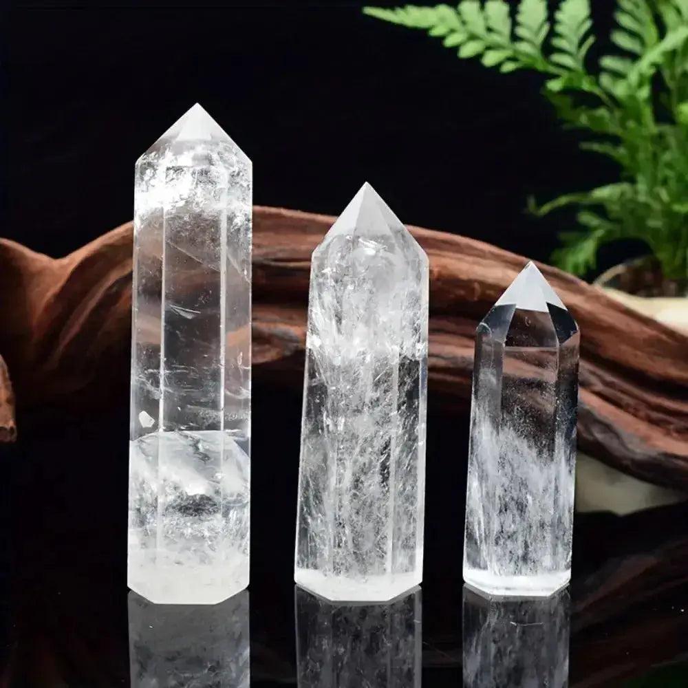 Three luminous Clear Quartz Hexagonal Crystal Towers, polished and transparent, amplify energy and promote clarity.