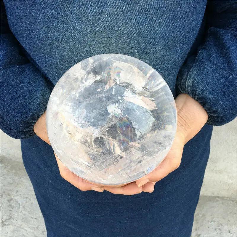 Large AAAA natural transparent white quartz crystal ball with internal rainbows, perfect for home decor and healing.