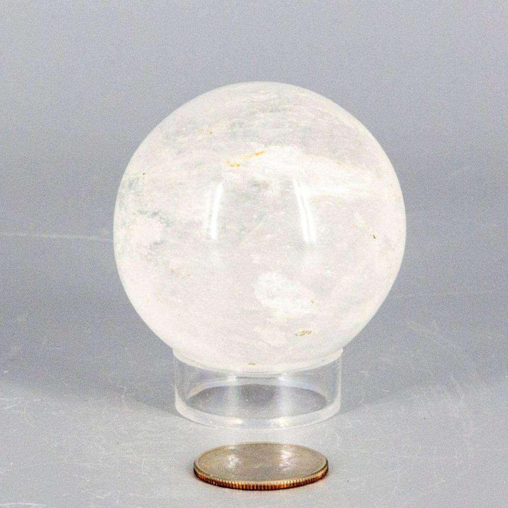 Natural Quartz Sphere Master Healer 53-55mm, a clear, polished crystal sphere radiating amplifying energy.