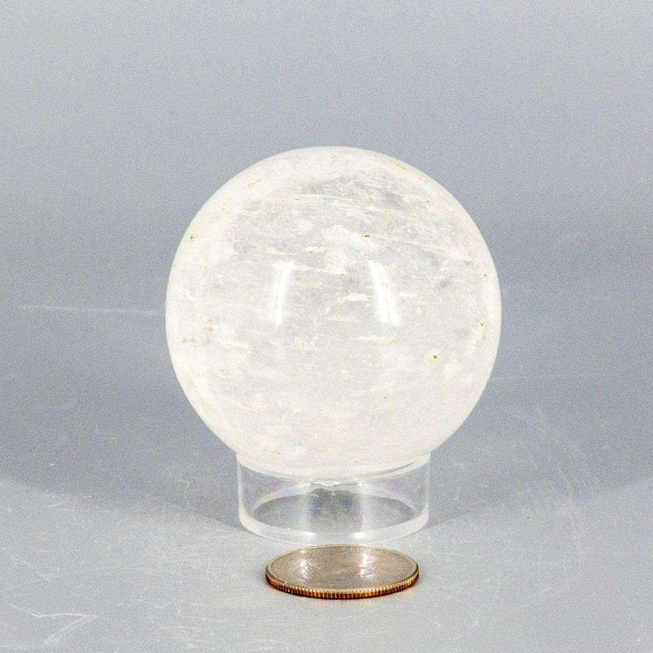Natural Quartz Sphere Master Healer 53-55mm, a clear, polished crystal sphere radiating amplifying energy.