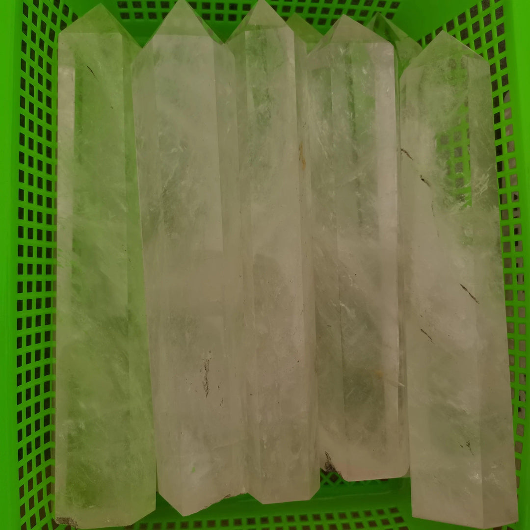 Clear Quartz Crystal Tower Obelisks, polished and substantial, amplifying healing and manifestation.