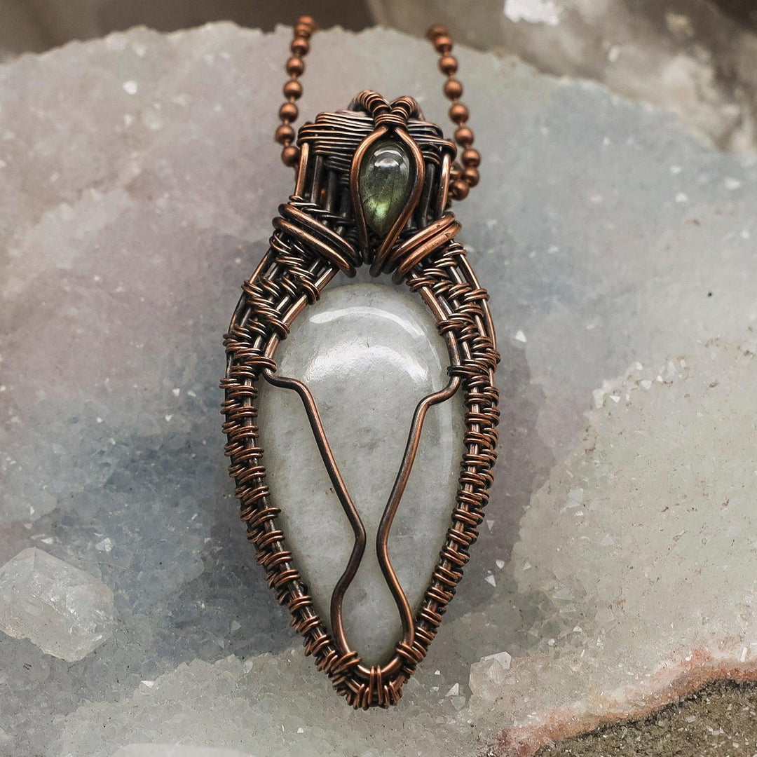 Handcrafted Clear Quartz Wire Wrap Crystal Pendant, a universal healer in copper, amplifying pure energy.
