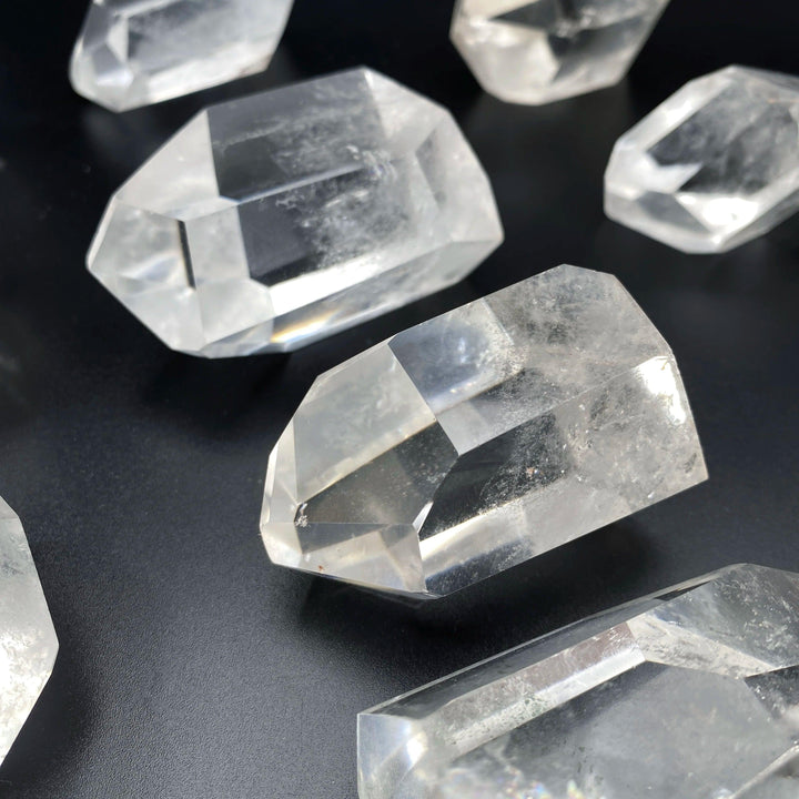 Natural clear quartz freeform crystals with sparkling facets, perfect for healing, meditation, and unique home decor.