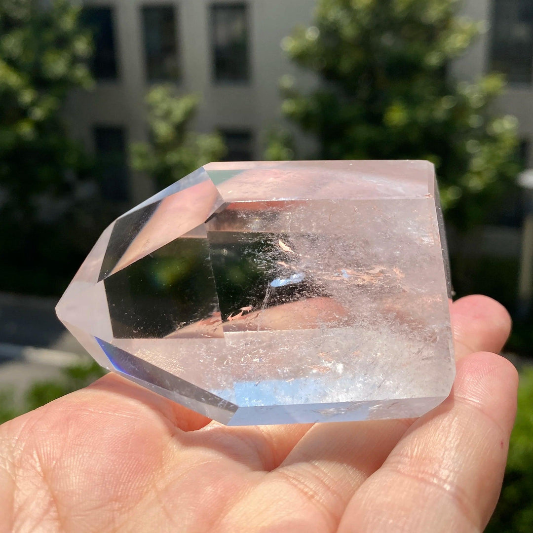 Natural clear quartz freeform crystal point with brilliant clarity, perfect for healing, meditation, and home decor.