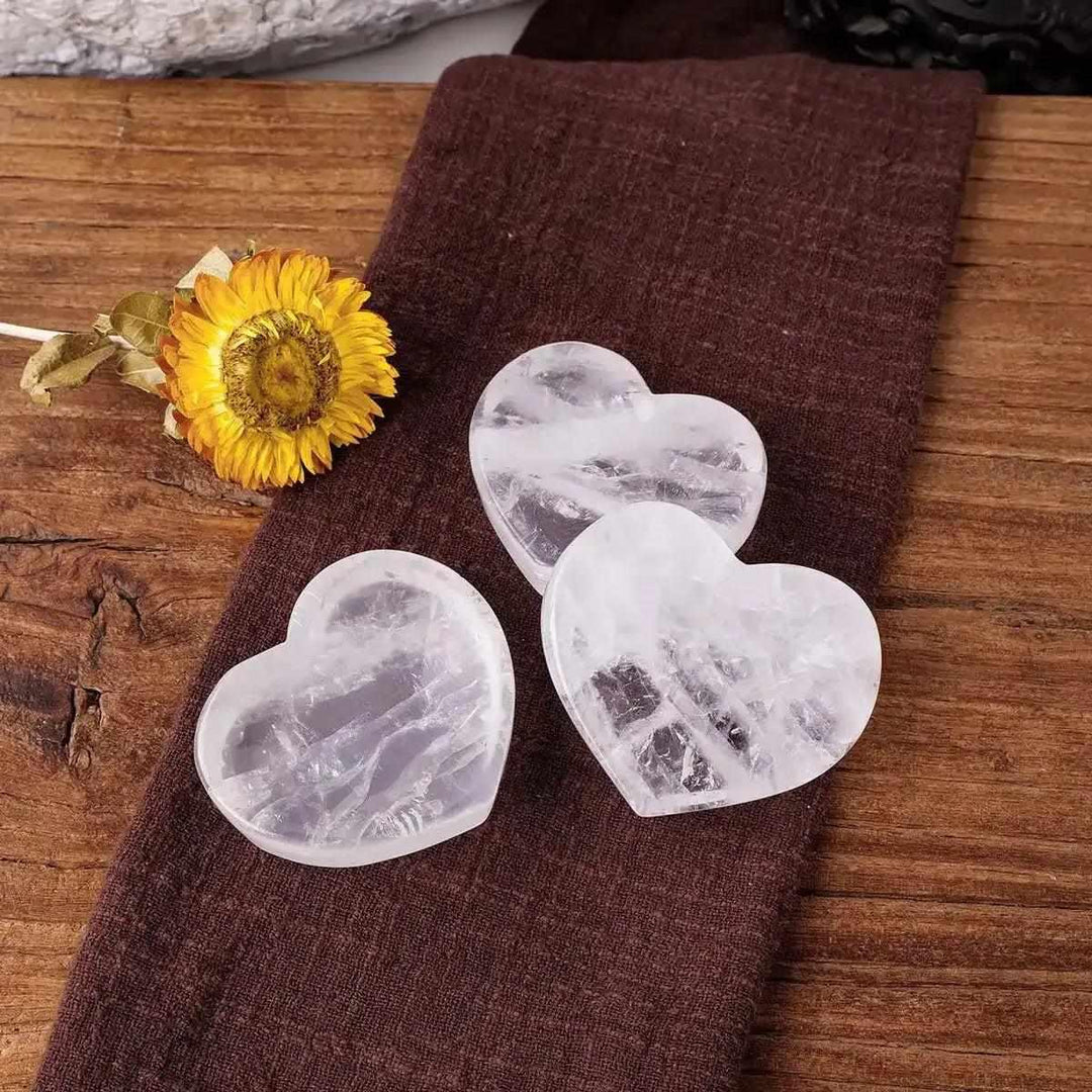 Polished clear quartz heart bowls, 50-60mm, perfect for crystal storage or Crown Chakra healing intentions.