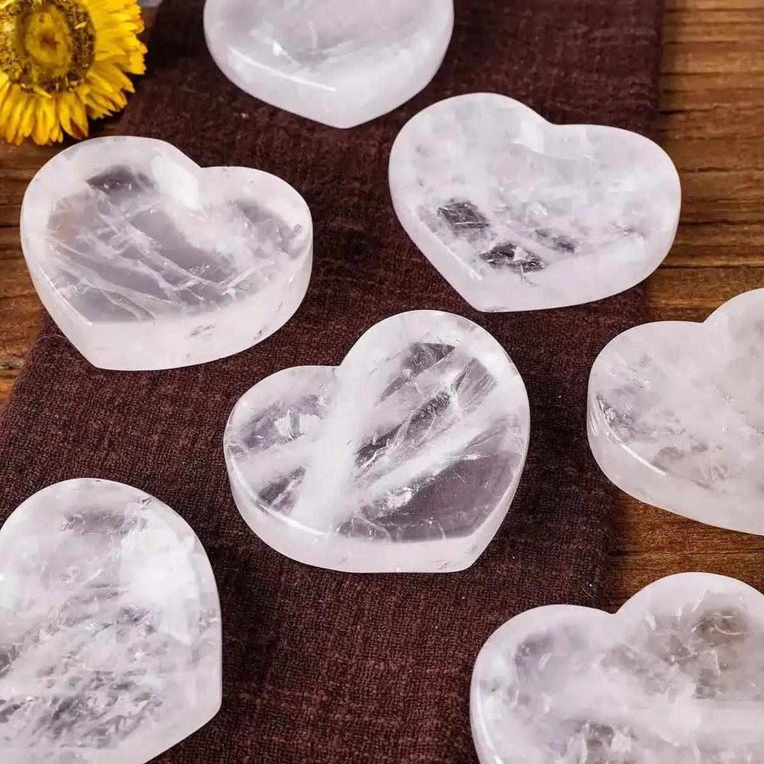 Polished clear quartz heart bowl, a 50-60mm crystal dish for Crown Chakra healing and amplifying intentions.