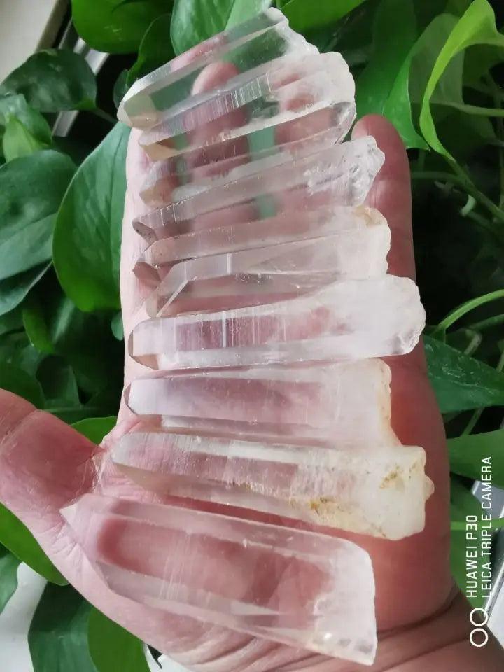 Clear Quartz Lemurian Seed Crystal Natural Wand Points, raw and unpolished, displaying horizontal striations.