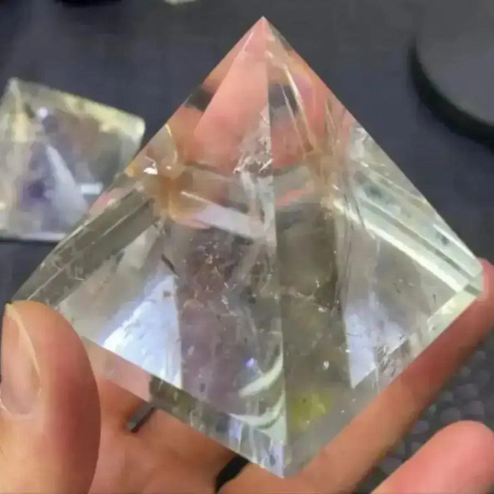 Hand-polished Clear Quartz mini pyramid with natural inclusions, perfect for Crown chakra meditation and energy focus.