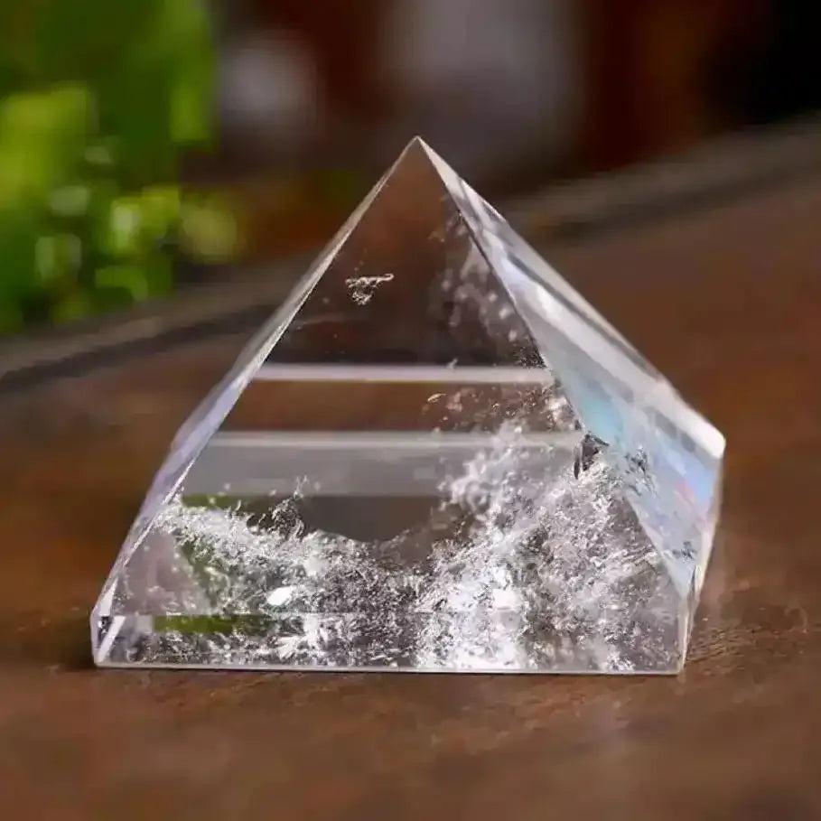 Hand-polished Clear Quartz mini pyramid with natural inclusions, perfect for amplifying intention and Crown chakra healing.