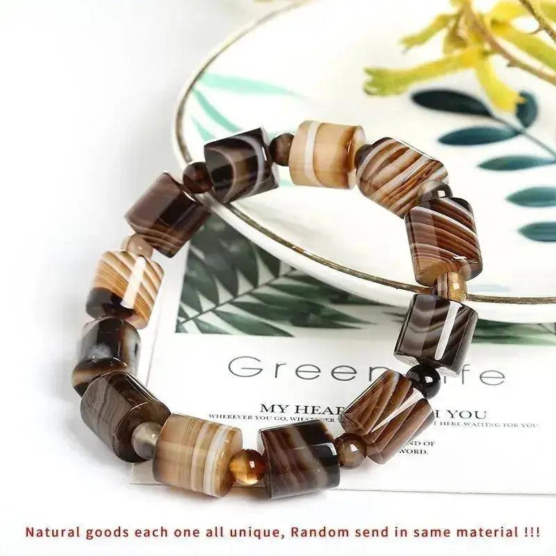 Coffee Lace Agate Tibetan Buddha Bracelet by Crystal Destiny, featuring polished brown and beige banded beads.