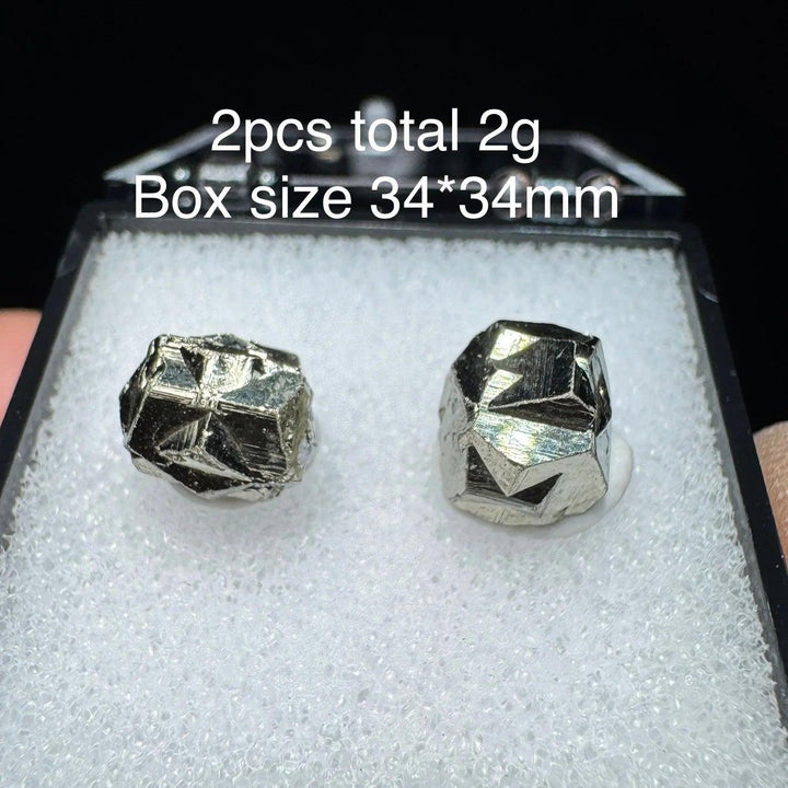 Two raw Colombia Cross Pyrite crystals with metallic gold luster in a 34x34mm display box for healing and home decor.