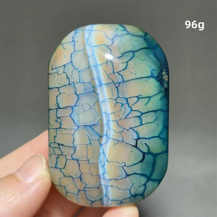 96g polished colorful dragon pattern agate palm stone with vibrant blue crackle veins for healing and meditation decor.