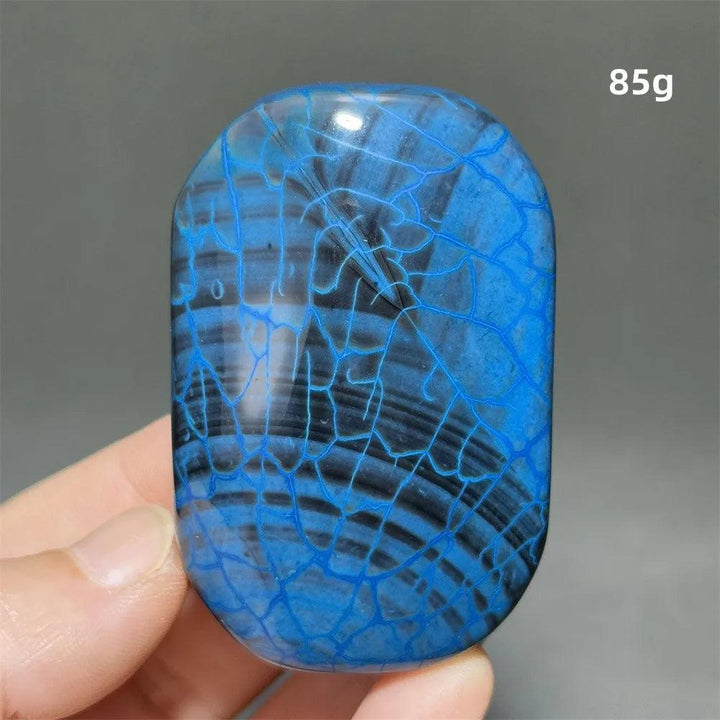 85g blue dragon pattern agate palm stone for healing, meditation, and feng shui home decor with unique crackle details.