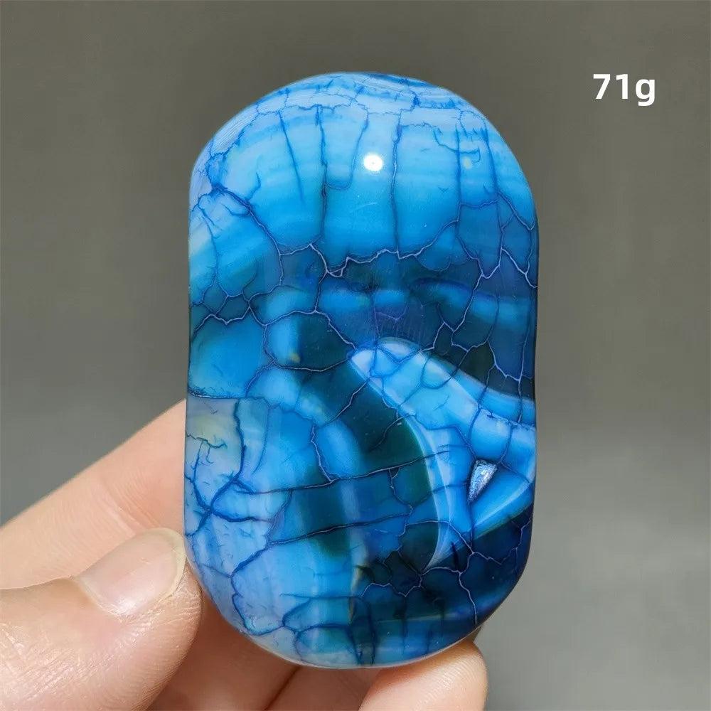 Polished blue dragon pattern agate palm stone, a 71g natural crystal for healing, meditation, and spiritual decor.