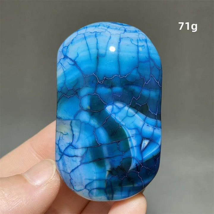 Polished blue dragon pattern agate palm stone, a 71g natural crystal for healing, meditation, and spiritual decor.