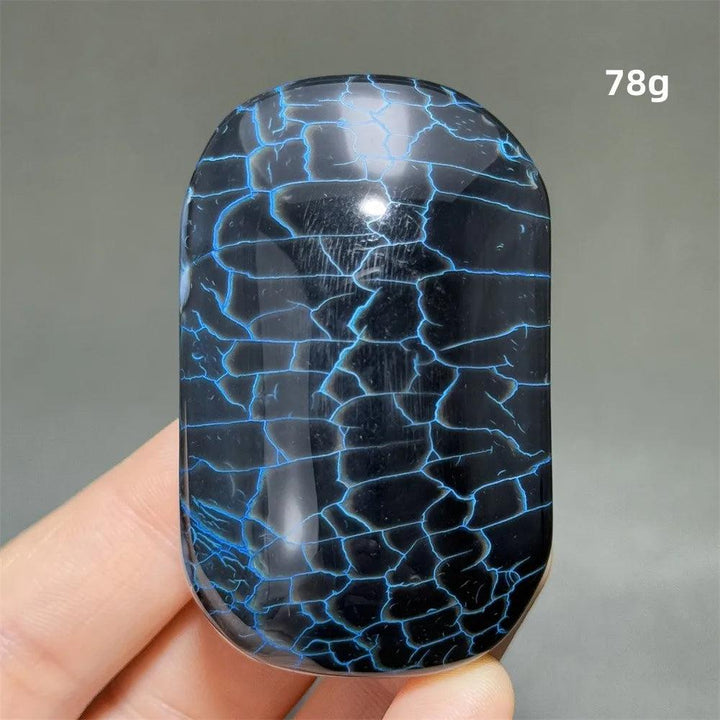 Polished 78g dragon pattern agate palm stone with striking blue crackle veins for healing, meditation, and home decor.