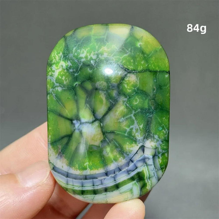 Polished green dragon pattern agate palm stone, 84g natural healing crystal for meditation and Feng Shui decor.