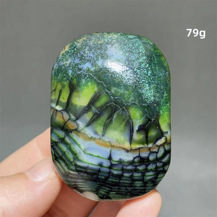 Polished 79g colorful dragon pattern agate palm stone, a natural healing crystal for meditation and Feng Shui decor.