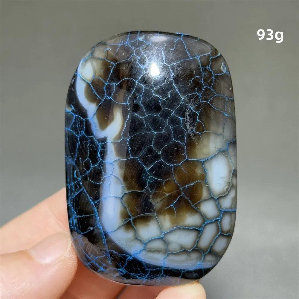93g polished dragon pattern agate palm stone with striking blue crackle veins for healing, meditation, and home decor.