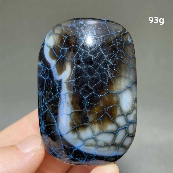 93g polished dragon pattern agate palm stone with striking blue crackle veins for healing, meditation, and home decor.