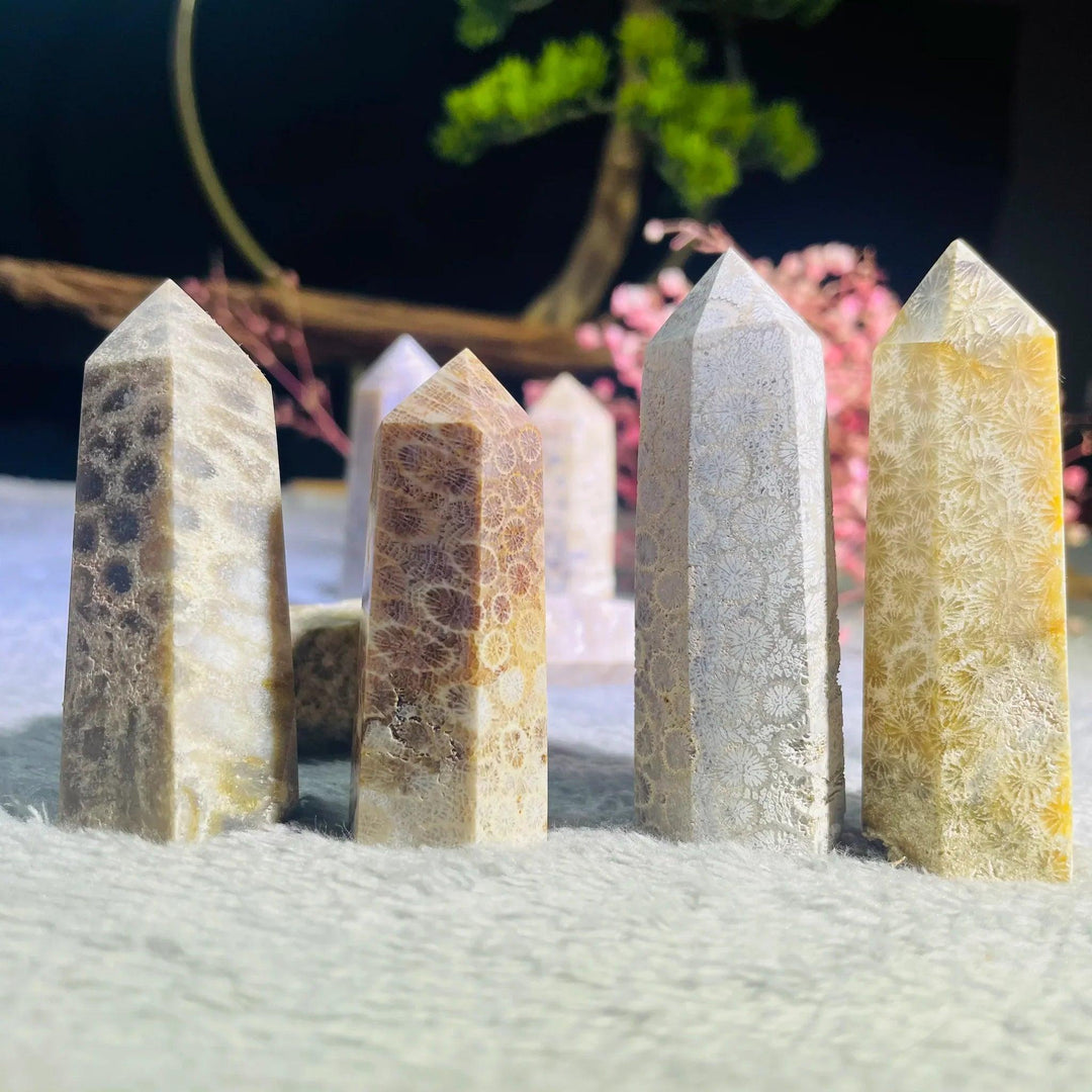 Polished Coral Jade Pillar Towers in natural yellow, brown, and grey fossil patterns for healing decor.