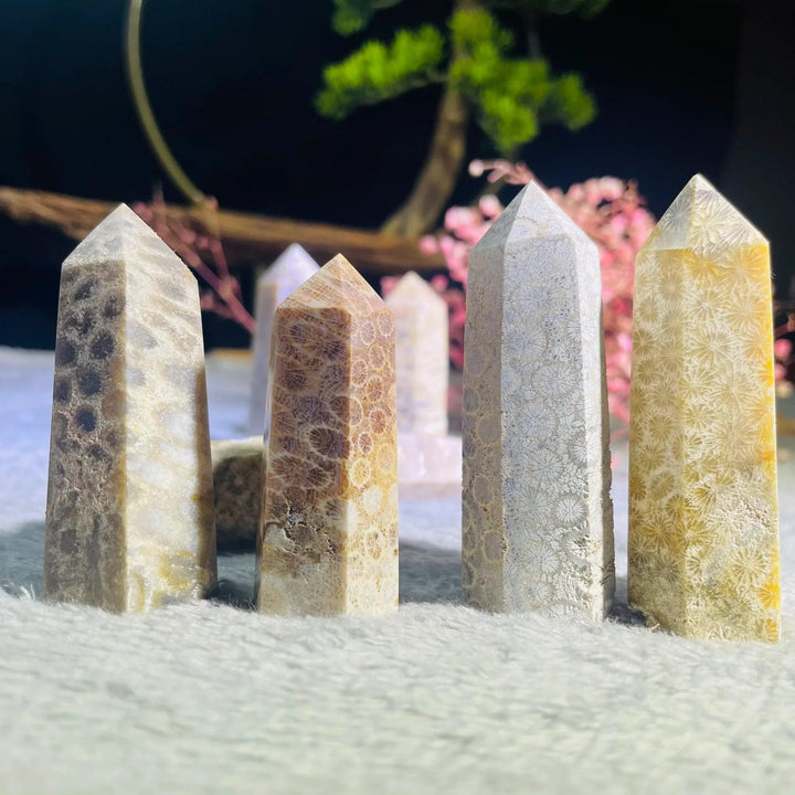 Polished Coral Jade Pillar Towers in natural yellow, brown, and grey fossil patterns for healing decor.