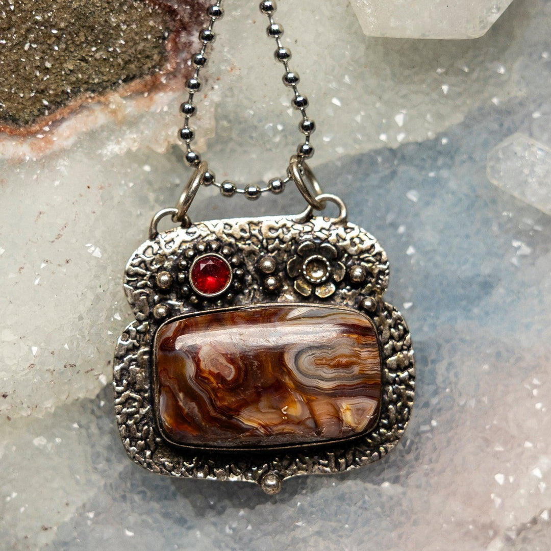 Crazy Lace Agate 925 Sterling Silver Pendant with intricate swirling patterns of cream, white, red, orange, and grey.