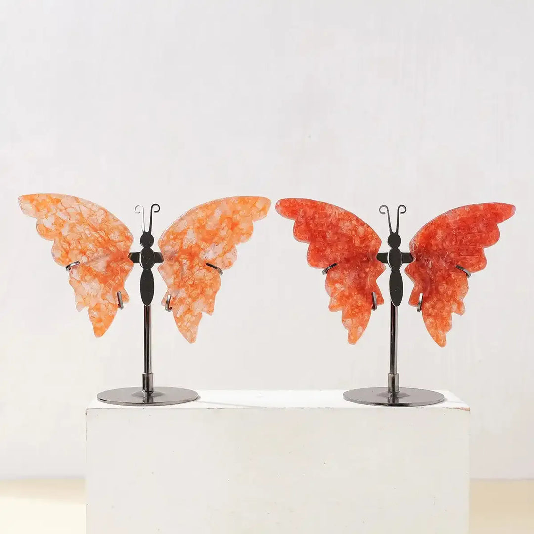 Crystal Carved Butterfly in vibrant orange and red stone on a metal stand, perfect for mindful decor and energy healing.