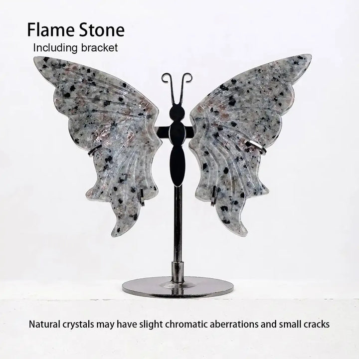Flame Stone Crystal Carved Butterfly on a display stand, featuring graceful wings with unique grey and black speckles.